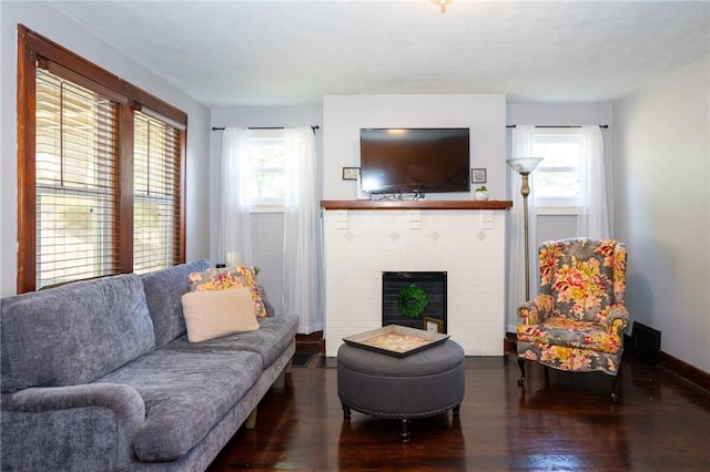 710 Beaver St, Leetsdale, PA 15056 - living room featuring wood finished floors, a fireplace, and baseboards