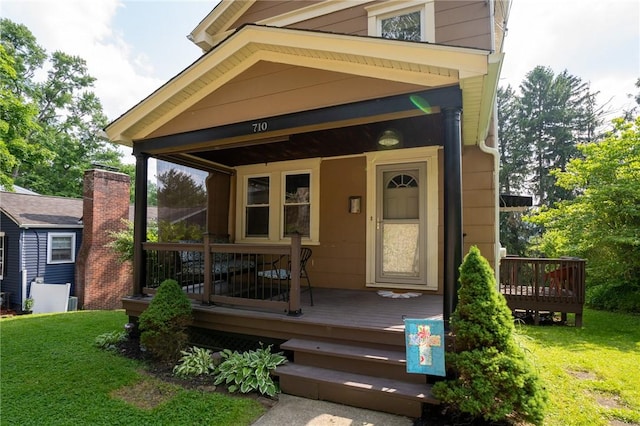 710 Beaver St, Leetsdale, PA 15056 - view of exterior entry with a yard and a deck