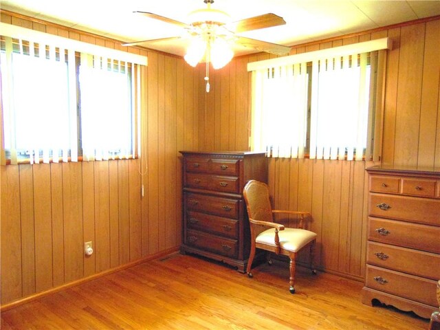 822 Fayette City Rd, Washington Twp, PA 15438 - living area featuring plenty of natural light, a ceiling fan, light wood-style floors, and wooden walls