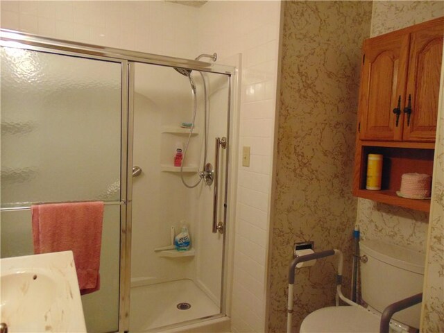 822 Fayette City Rd, Washington Twp, PA 15438 - full bathroom with wallpapered walls, a stall shower, toilet, and vanity