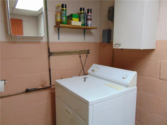 822 Fayette City Rd, Washington Twp, PA 15438 - washroom featuring washer / clothes dryer, concrete block wall, and cabinet space