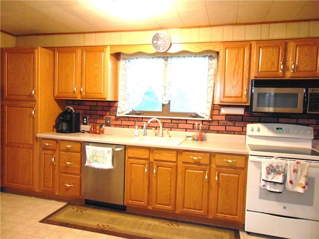 822 Fayette City Rd, Washington Twp, PA 15438 - kitchen featuring stainless steel appliances, a sink, and brown cabinetry