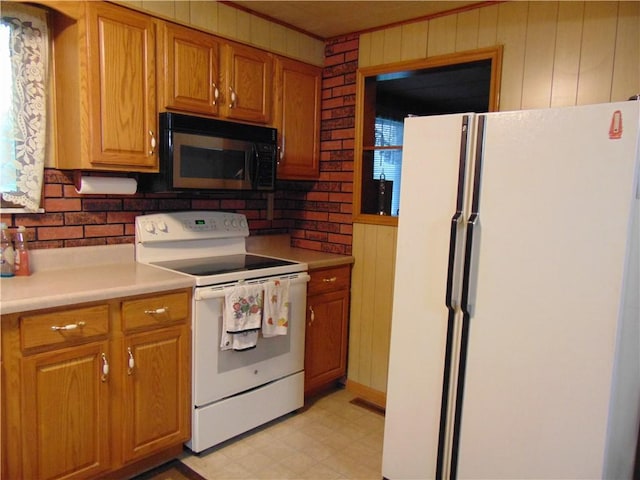 822 Fayette City Rd, Washington Twp, PA 15438 - kitchen featuring white appliances, light countertops, light flooring, tasteful backsplash, and wooden walls