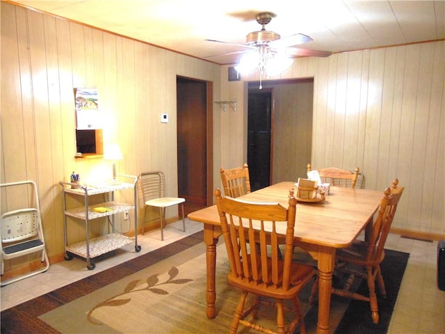 822 Fayette City Rd, Washington Twp, PA 15438 - dining room with a ceiling fan and wooden walls
