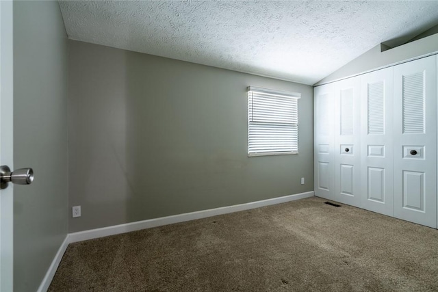 208 Green Ct, Castle Shannon, PA 15234 - unfurnished bedroom featuring carpet flooring, a textured ceiling, baseboards, lofted ceiling, and a closet