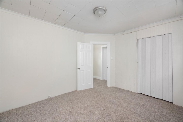 330 N Elm St, City Of But Nw, PA 16001 - unfurnished bedroom featuring carpet, a closet, and ornamental molding