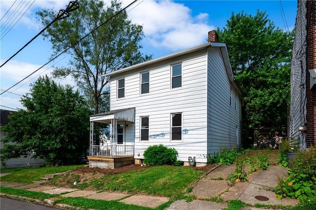 330 N Elm St, City Of But Nw, PA 16001 - view of front of property featuring a chimney