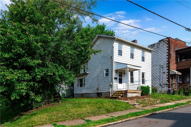 330 N Elm St, City Of But Nw, PA 16001 - view of front of property featuring a chimney and a front lawn
