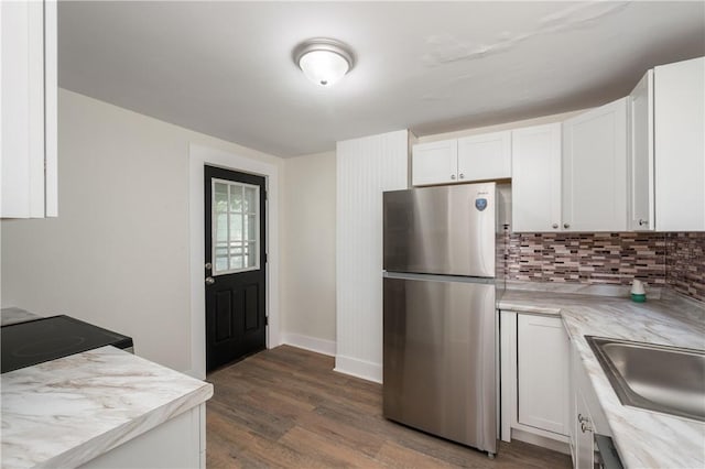 330 N Elm St, City Of But Nw, PA 16001 - kitchen with freestanding refrigerator, backsplash, light countertops, white cabinetry, and dark wood-style flooring