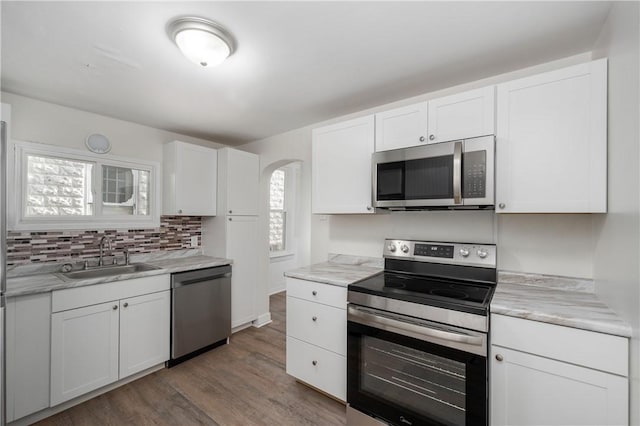 330 N Elm St, City Of But Nw, PA 16001 - kitchen featuring stainless steel appliances, a sink, white cabinets, and wood finished floors