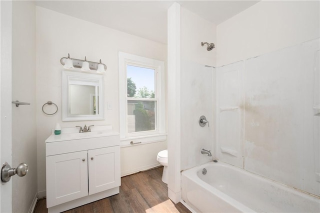 330 N Elm St, City Of But Nw, PA 16001 - bathroom featuring toilet, vanity, wood finished floors, and bathtub / shower combination