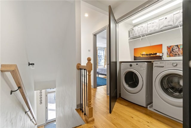 626 Suismon St, East Allegheny, PA 15212 - laundry room with washer and clothes dryer and light wood-type flooring