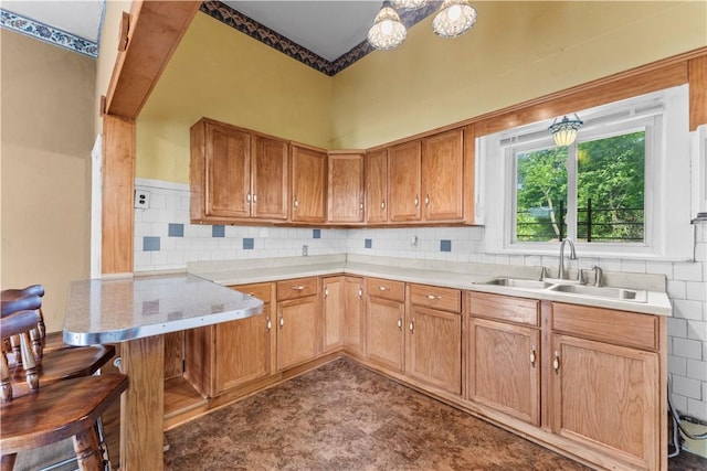 222 Marshall Ave, Observatory Hill, PA 15214 - kitchen with a sink, a peninsula, light countertops, and tasteful backsplash