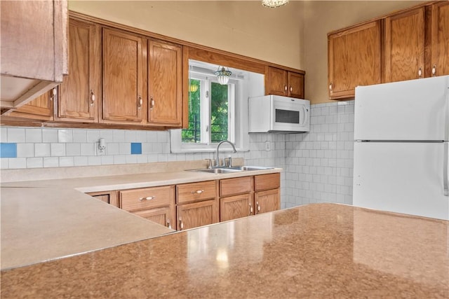 222 Marshall Ave, Observatory Hill, PA 15214 - kitchen with white appliances, a sink, brown cabinetry, and light countertops