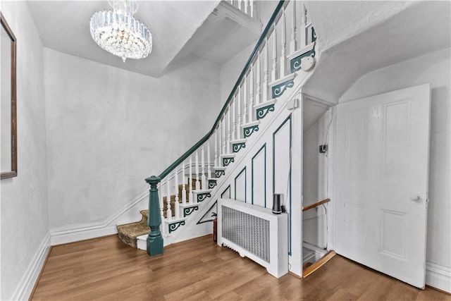 222 Marshall Ave, Observatory Hill, PA 15214 - staircase featuring a chandelier, wood finished floors, radiator heating unit, and baseboards