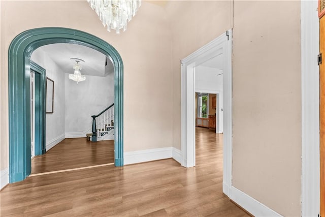 222 Marshall Ave, Observatory Hill, PA 15214 - foyer entrance with a chandelier, arched walkways, wood finished floors, stairs, and baseboards