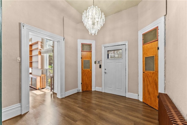 222 Marshall Ave, Observatory Hill, PA 15214 - entryway featuring dark wood-style floors, a chandelier, radiator heating unit, baseboards, and a high ceiling