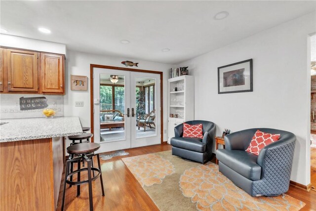 106 Shawnee Dr, Center Twp, PA 16001 - living room with french doors, wood finished floors, and recessed lighting