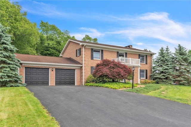 106 Shawnee Dr, Center Twp But, PA 16001 - view of front facade featuring a garage, brick siding, asphalt driveway, and a front lawn
