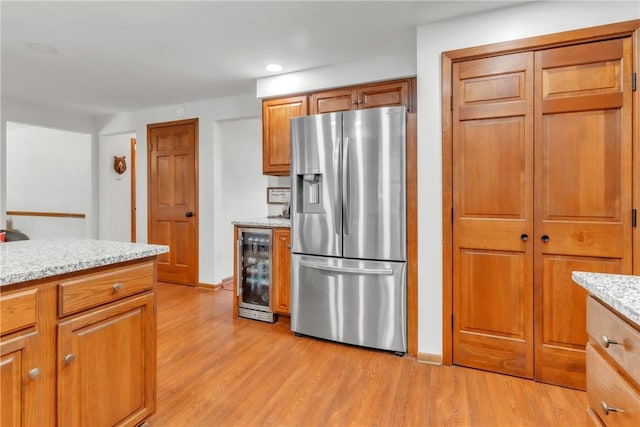 106 Shawnee Dr, Center Twp But, PA 16001 - kitchen with stainless steel refrigerator with ice dispenser, wine cooler, light wood-style floors, brown cabinetry, and recessed lighting