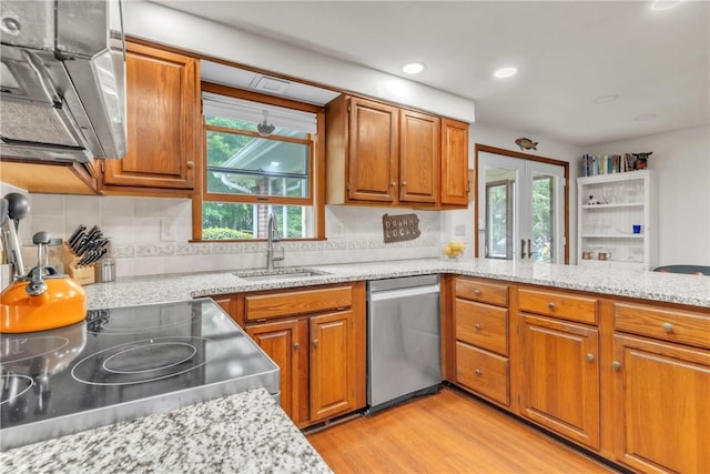 106 Shawnee Dr, Center Twp But, PA 16001 - kitchen with stainless steel appliances, a sink, brown cabinets, light wood-style floors, and recessed lighting