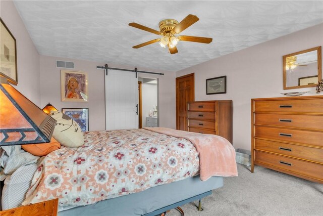 106 Shawnee Dr, Center Twp But, PA 16001 - carpeted bedroom featuring a barn door and ceiling fan