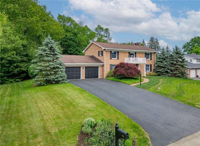 106 Shawnee Dr, Center Twp, PA 16001 - view of front of house with a garage, driveway, brick siding, and a front yard