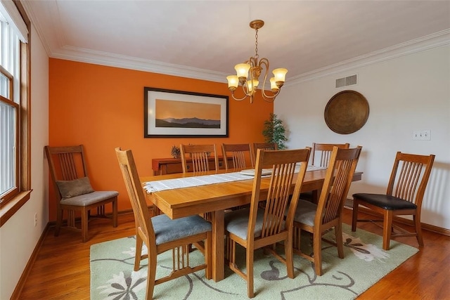 106 Shawnee Dr, Center Twp, PA 16001 - dining area with a chandelier, ornamental molding, and wood finished floors