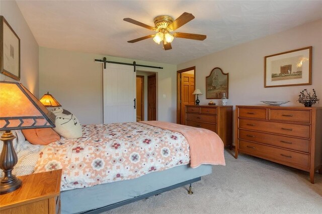106 Shawnee Dr, Center Twp, PA 16001 - bedroom featuring a barn door, light carpet, and a ceiling fan