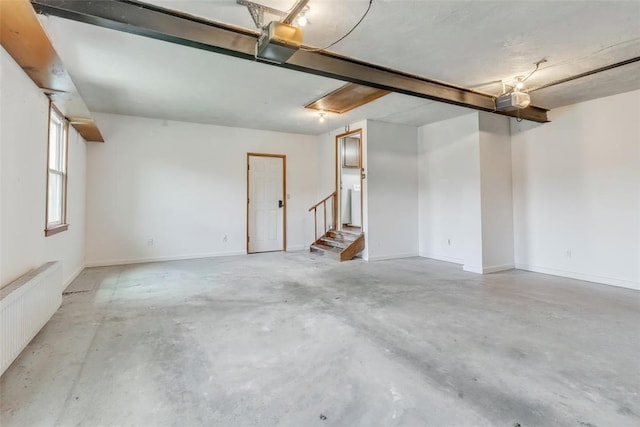 106 Shawnee Dr, Center Twp, PA 16001 - garage featuring radiator heating unit and a garage door opener