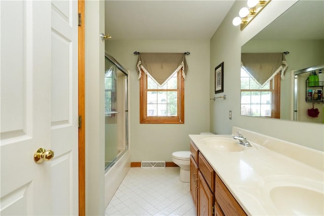 215 Warren Rd, Marshall, PA 15086 - bathroom featuring double vanity, tile patterned floors, toilet, enclosed tub / shower combo, and baseboards