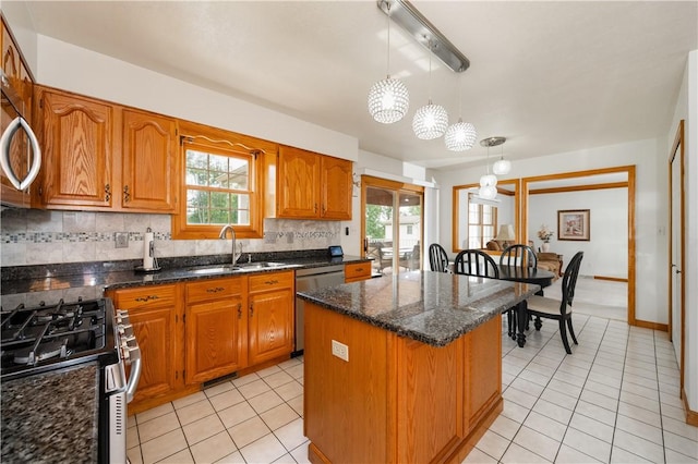 215 Warren Rd, Marshall, PA 15086 - kitchen with appliances with stainless steel finishes, a sink, a center island, and light tile patterned floors