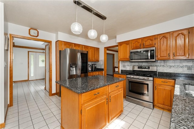 215 Warren Rd, Marshall, PA 15086 - kitchen featuring appliances with stainless steel finishes, light tile patterned flooring, backsplash, a center island, and brown cabinetry