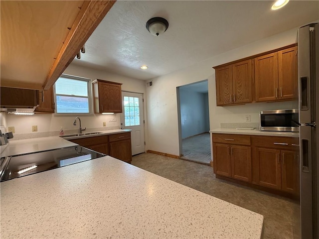 635 Valley St, Oakmont, PA 15139 - kitchen featuring stainless steel microwave, a sink, range with electric cooktop, light countertops, and freestanding refrigerator