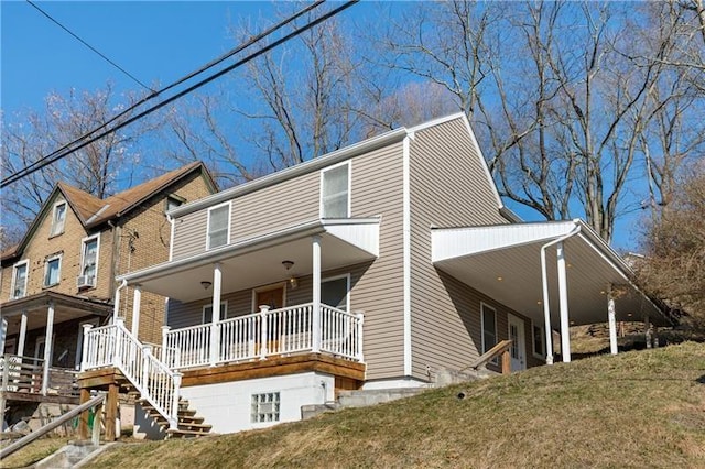 635 Valley St, Oakmont, PA 15139 - view of front of house with a porch, stairway, and a front yard