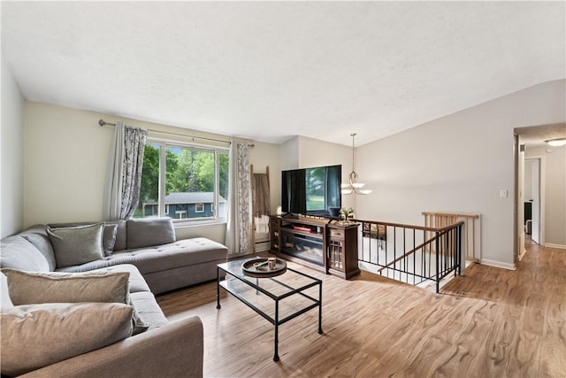 102 Castle Hill Rd, Monroeville, PA 15146 - living room featuring lofted ceiling, wood finished floors, and baseboards