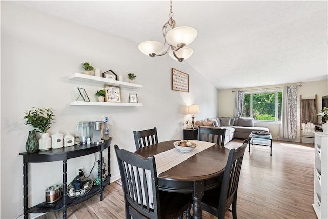 102 Castle Hill Rd, Monroeville, PA 15146 - dining space featuring a chandelier, wood finished floors, and lofted ceiling