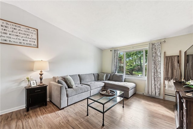 102 Castle Hill Rd, Monroeville, PA 15146 - living area featuring wood finished floors, vaulted ceiling, and baseboards