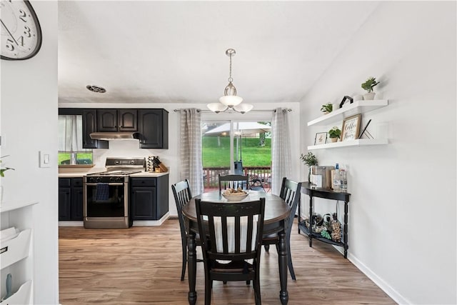 102 Castle Hill Rd, Monroeville, PA 15146 - dining area featuring light wood-style flooring, baseboards, and a chandelier
