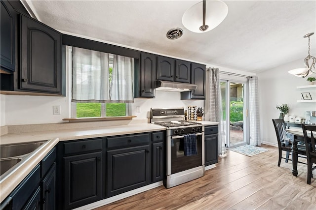 102 Castle Hill Rd, Monroeville, PA 15146 - kitchen featuring gas range oven, under cabinet range hood, plenty of natural light, light wood-type flooring, and lofted ceiling