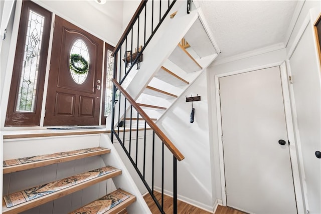 102 Castle Hill Rd, Monroeville, PA 15146 - entryway with wood finished floors, healthy amount of natural light, stairs, and ornamental molding