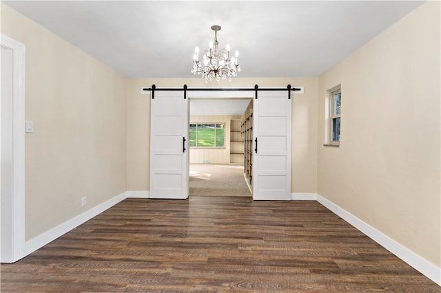 4649 Rolling Hills Rd, Whitehall, PA 15236 - unfurnished dining area featuring a barn door, a chandelier, dark wood-style flooring, and baseboards