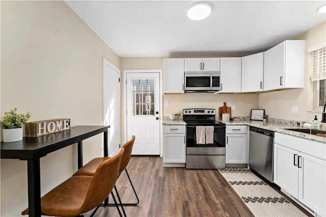 4649 Rolling Hills Rd, Whitehall, PA 15236 - kitchen with appliances with stainless steel finishes, healthy amount of natural light, a sink, and dark wood finished floors