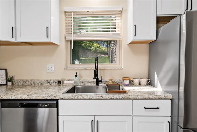 4649 Rolling Hills Rd, Whitehall, PA 15236 - kitchen with stainless steel appliances, a sink, white cabinets, and light stone countertops