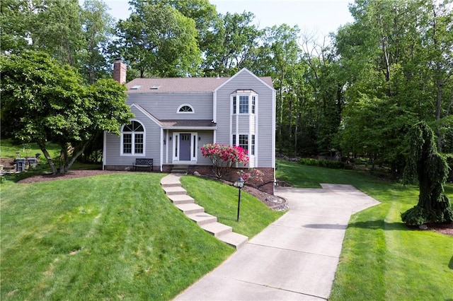 407 Highland Ct, Marshall, PA 15090 - view of front of home with a front yard, a chimney, concrete driveway, and roof with shingles