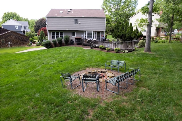407 Highland Ct, Marshall, PA 15090 - rear view of house with a deck, a yard, and a fire pit