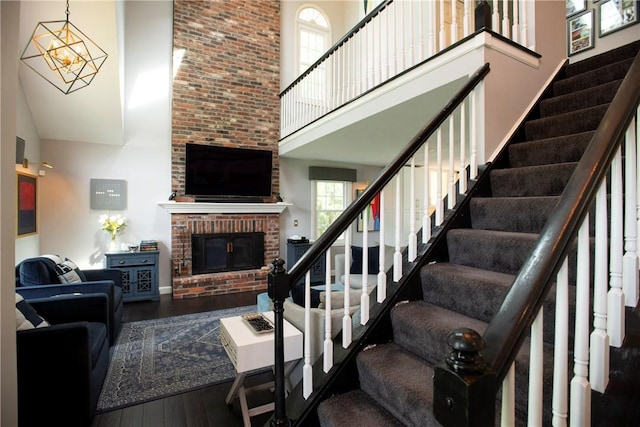 407 Highland Ct, Marshall, PA 15090 - staircase with a high ceiling, wood finished floors, and a fireplace