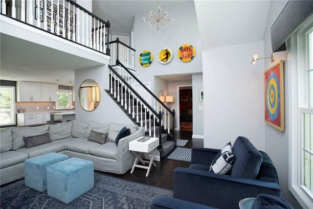 407 Highland Ct, Marshall, PA 15090 - living room featuring a chandelier, wood finished floors, stairs, and a towering ceiling