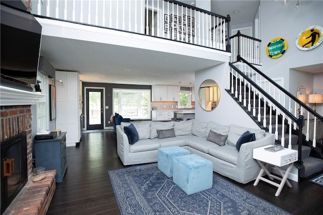 407 Highland Ct, Marshall, PA 15090 - living area featuring stairway, dark wood finished floors, a fireplace, and a high ceiling