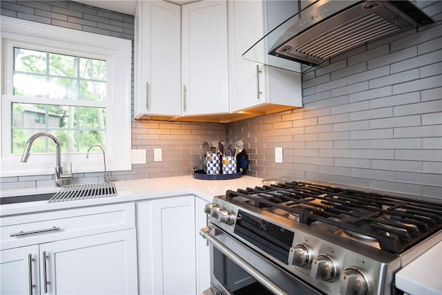 407 Highland Ct, Marshall, PA 15090 - kitchen featuring stainless steel gas range oven, extractor fan, a sink, light countertops, and white cabinetry